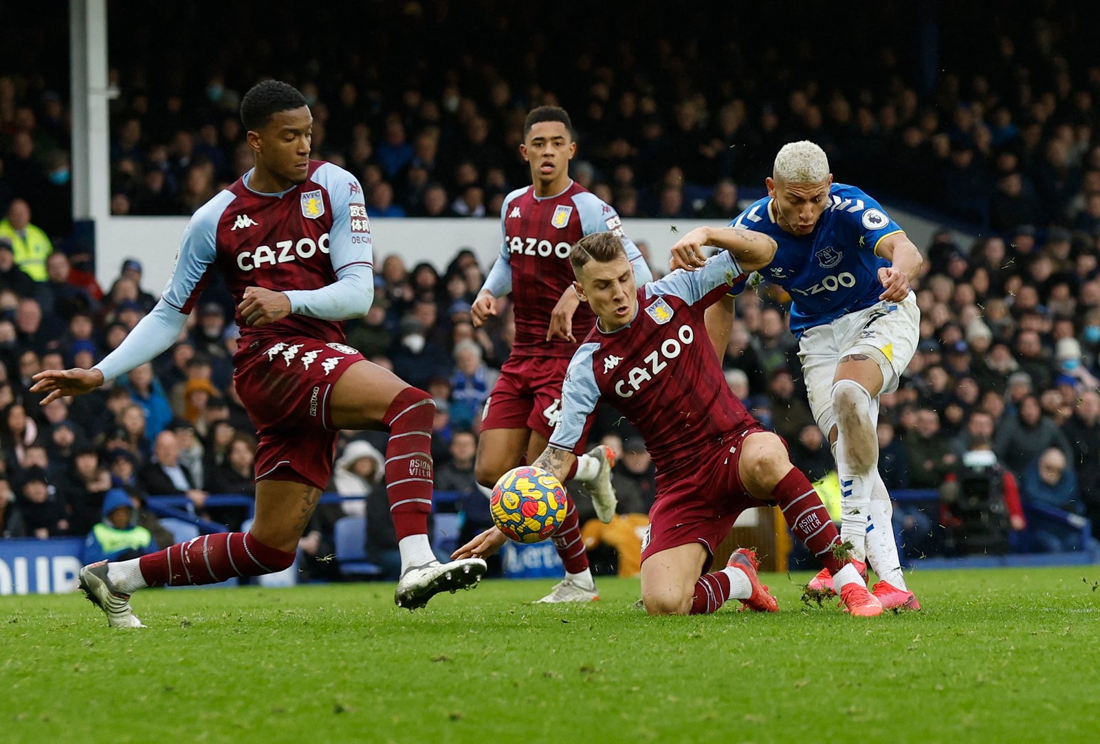 Villa win at struggling Everton as objects rain down from the stands